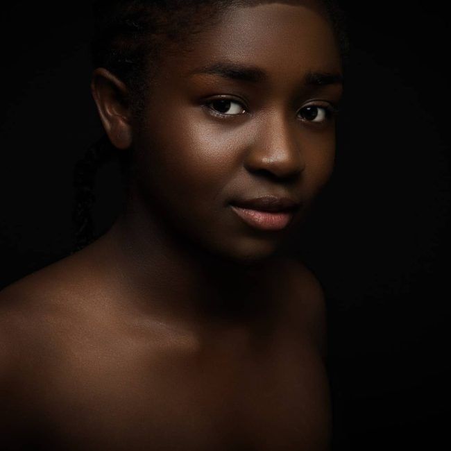 natural-and-beautiful-woman-with-dark-skin-on-black-bakground